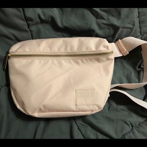 Pale pink Herschel belt bag.